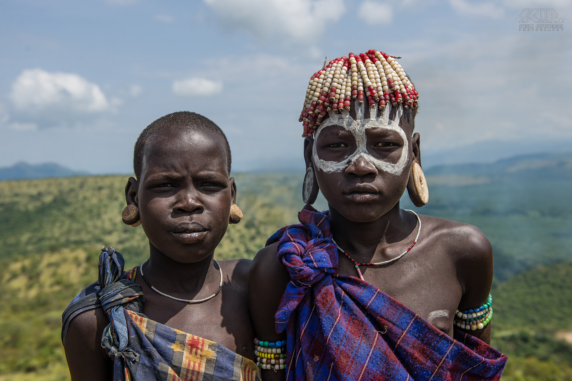 Mago - Mursi boys Two Mursi boy with big earplates in their ears and a painted face.  The Mursi left a big impression on us. Stefan Cruysberghs